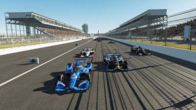 Competição de fórmula Indy com carro azul em destaque na pista 
