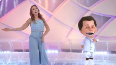 Patrícia Abravanel em cena na vinheta de fim de ano do SBT ao lado da versão animada de Silvio Santos 