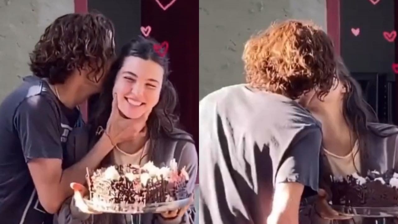 Alanis Guillen e Jesuíta Barbosa se beijando, ela segurando um bolo